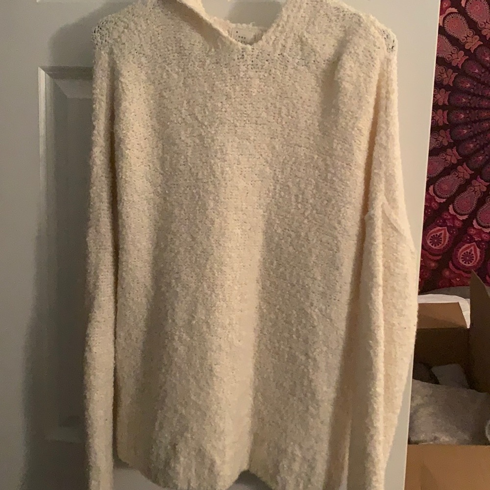 Long sleeve cream sweater; has hood
